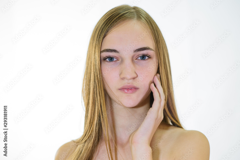 Beautiful young fair-haired girl with well-groomed skin. Studio shot Beautiful young fair-haired girl with well-groomed skin. Studio shot