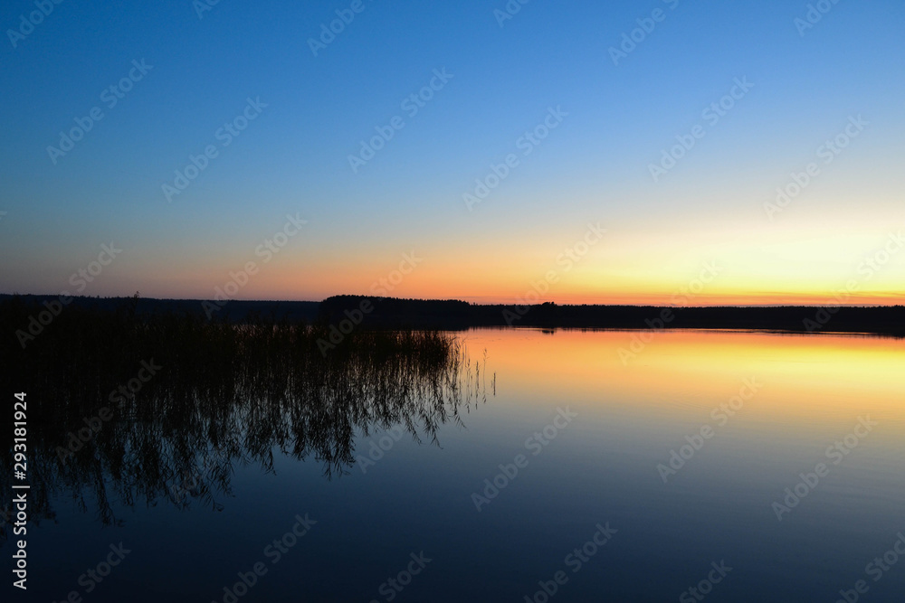 sunset over lake in visaginas