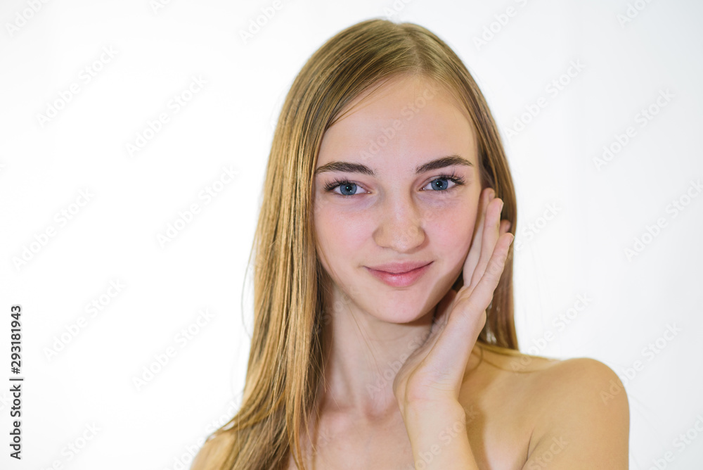 Beautiful young fair-haired girl with well-groomed skin. Studio shot Beautiful young fair-haired girl with well-groomed skin. Studio shot