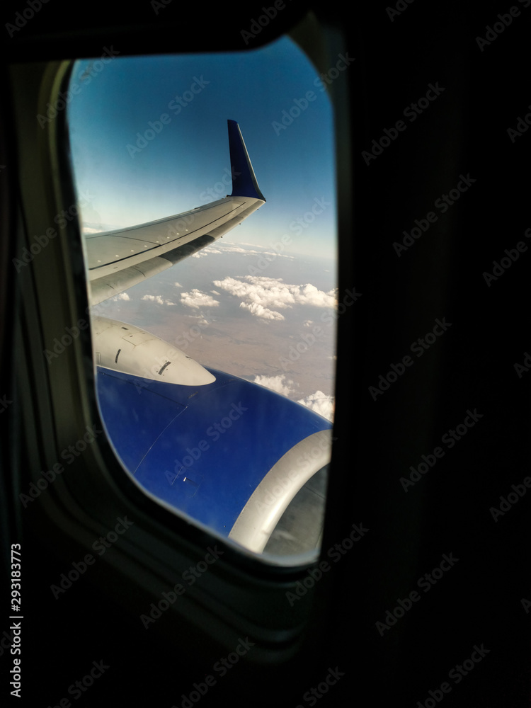 wing and jet turbine cloudy earth view through the plane window wing and jet turbine cloudy earth view through the plane window