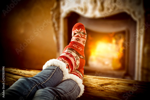 Retro fireplace and woan legs with christmas socks 