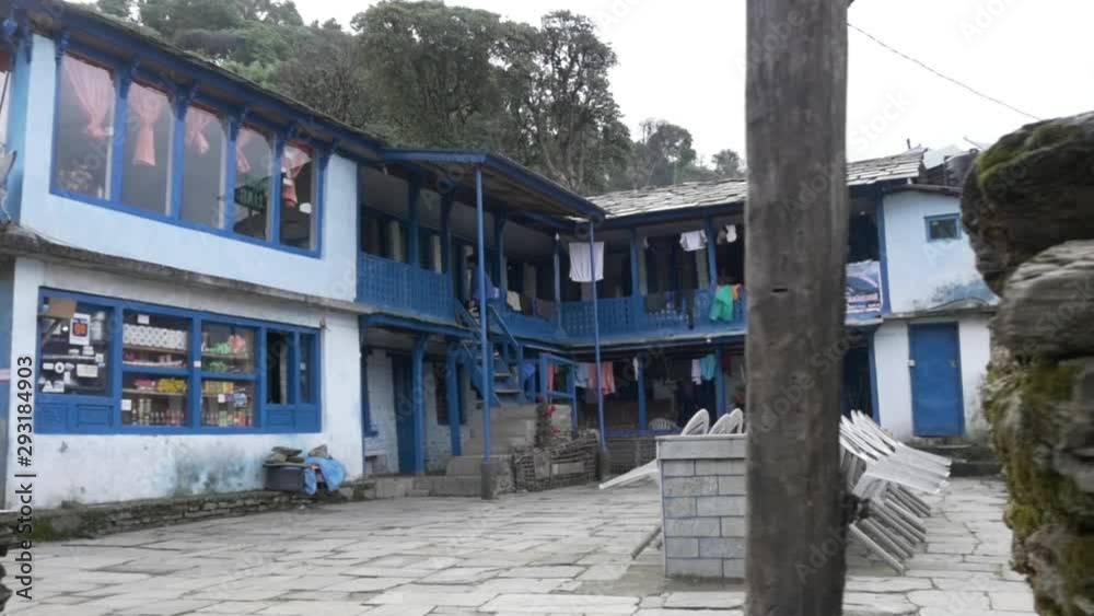 Young Woman Walking up Steps in a House in Himalayan Village in Nepal, Annapurna Region, Slow Motion. Young Woman Walking up Steps in a House in Himalayan Village in Nepal, Annapurna Region, Slow Motion.