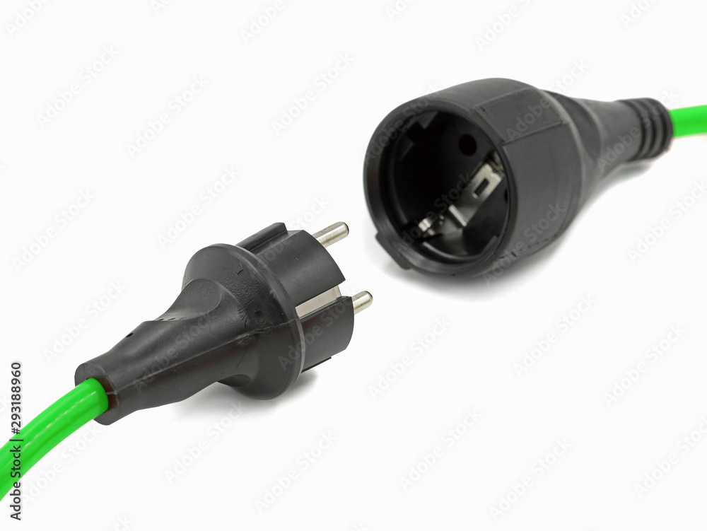 close up, disconnected green electrical power extension cable with EU plug, green energy close up, disconnected green electrical power extension cable with EU plug, green energy