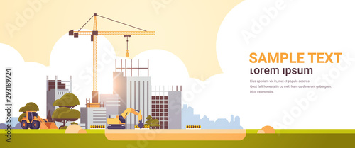 modern construction site with cranes tractor and bulldozer unfinished building exterior sunset background flat horizontal copy space