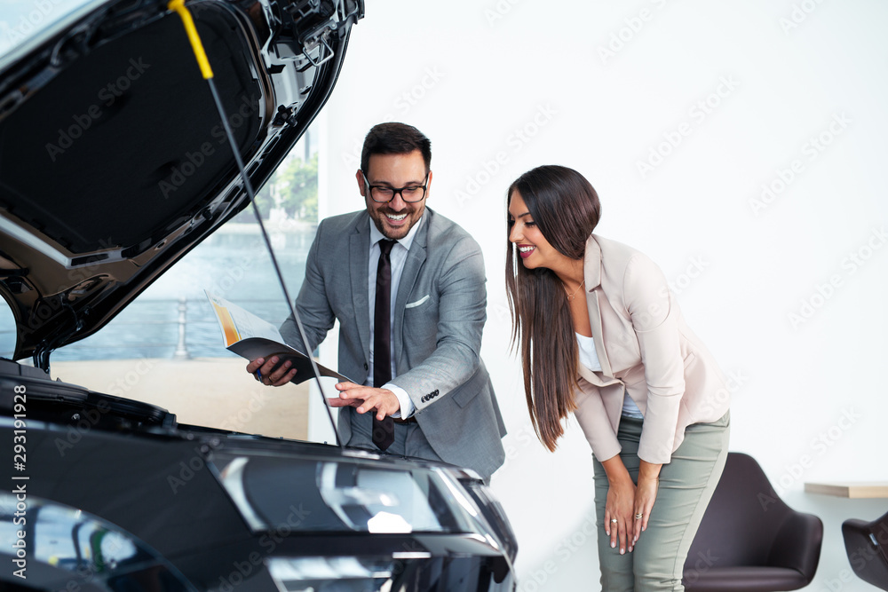 Customer buying a vehicle at car dealership Customer buying a vehicle at car dealership
