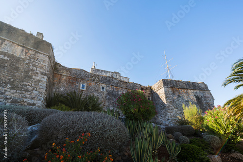 Old stone walls of the Citadel of Cascais (Cidadela de Cascais) in Cascais, Portugal, on a sunny day in the summer. photo