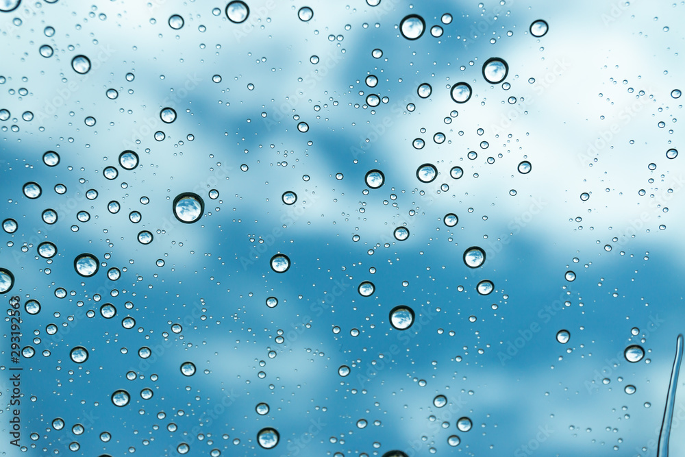 Rain on the window, natural skin of the rain The natural form of rainwater on a sky background.