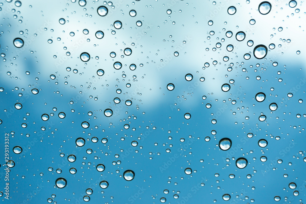 Rain on the window, natural skin of the rain The natural form of rainwater on a sky background. Rain on the window, natural skin of the rain The natural form of rainwater on a sky background.