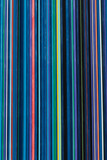 striped background of thin bright stripes of different colors