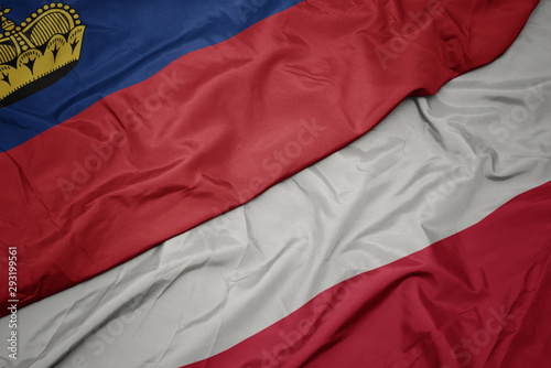 waving colorful flag of poland and national flag of liechtenstein.