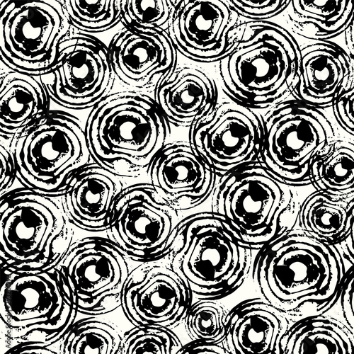 Black and white geometric circle seamless vector pattern background print in a tribal style.