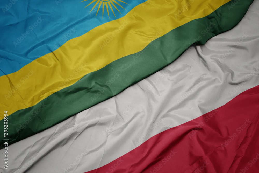 waving colorful flag of poland and national flag of rwanda. waving colorful flag of poland and national flag of rwanda.