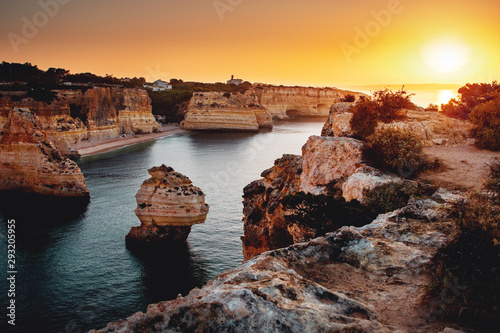 Idyllic beach and coast view at a calm morning with the rock sand stone nature landscape. Praia da Marinha, Famous Beach, Algarve Coast in South Portugal, Atlantic Ocean