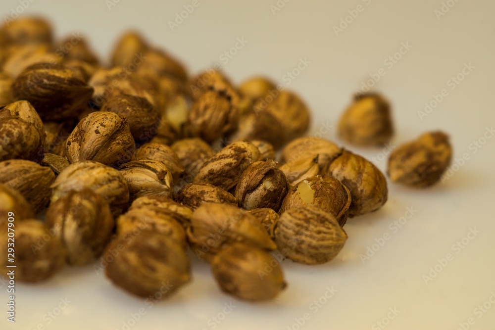 Right Hazelnuts kernels in the background. Right Hazelnuts kernels in the background.