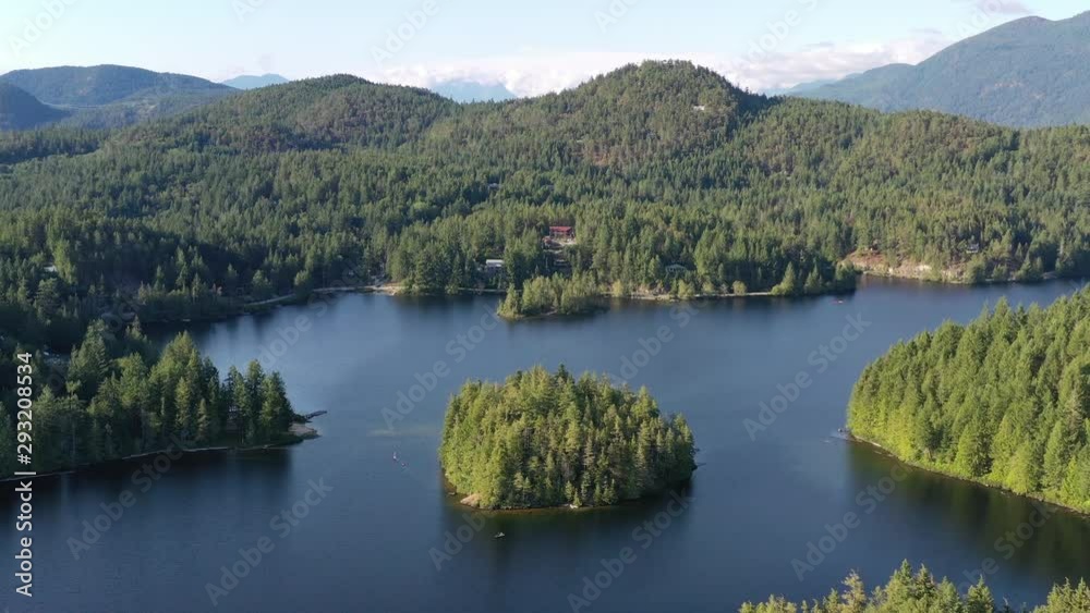 Aerial View at Mountain Lake with Blue Sky in British Columbia, Canada. 4K. Aerial View at Mountain Lake with Blue Sky in British Columbia, Canada. 4K.