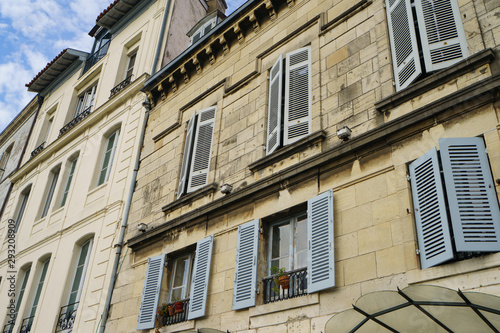 Architecture of ancient city. Facade of residential houses in French Bayonne. Concept of touristic impressions in Nouvelle Aquitaine.