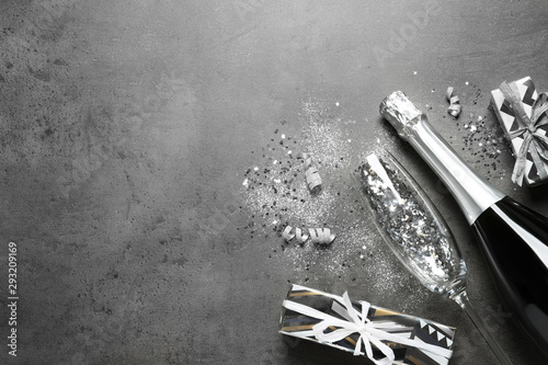 Konstfotografi Flat lay composition with bottle of champagne for celebration on grey stone background