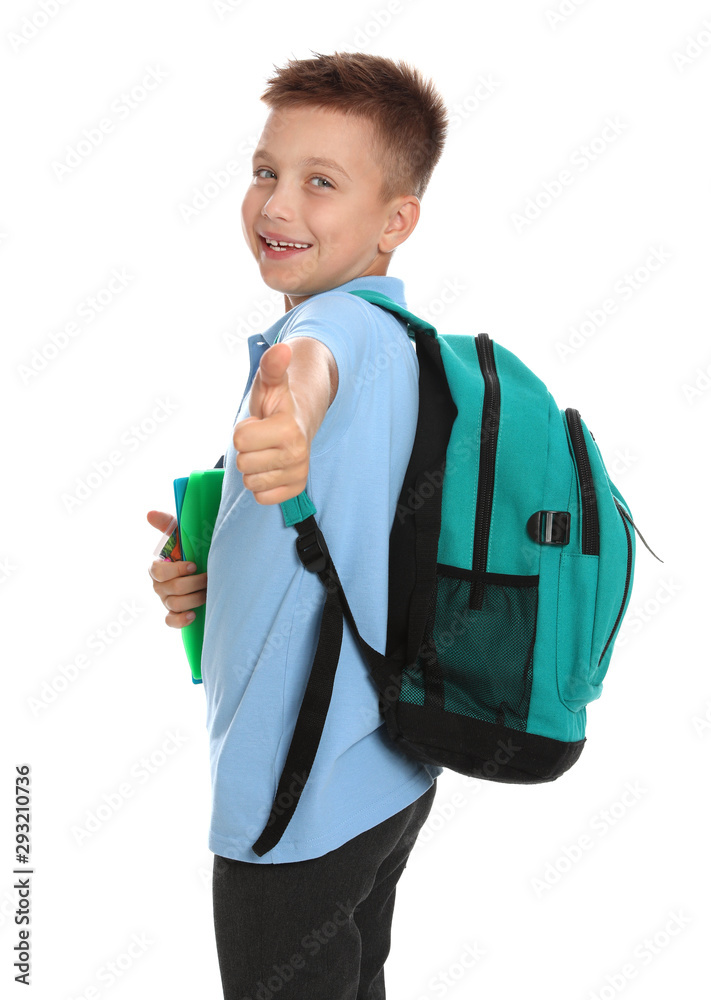 Cute little boy in school uniform with backpack and stationery showing thumbs-up on white background Cute little boy in school uniform with backpack and stationery showing thumbs-up on white background