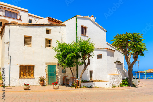 Typical white house on street of Sa Tuna fishing village, Costa Brava, Catalonia, Spain