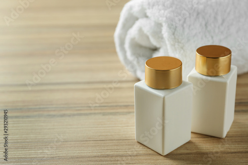 Composition with cosmetic products on wooden table  space for text. Spa therapy