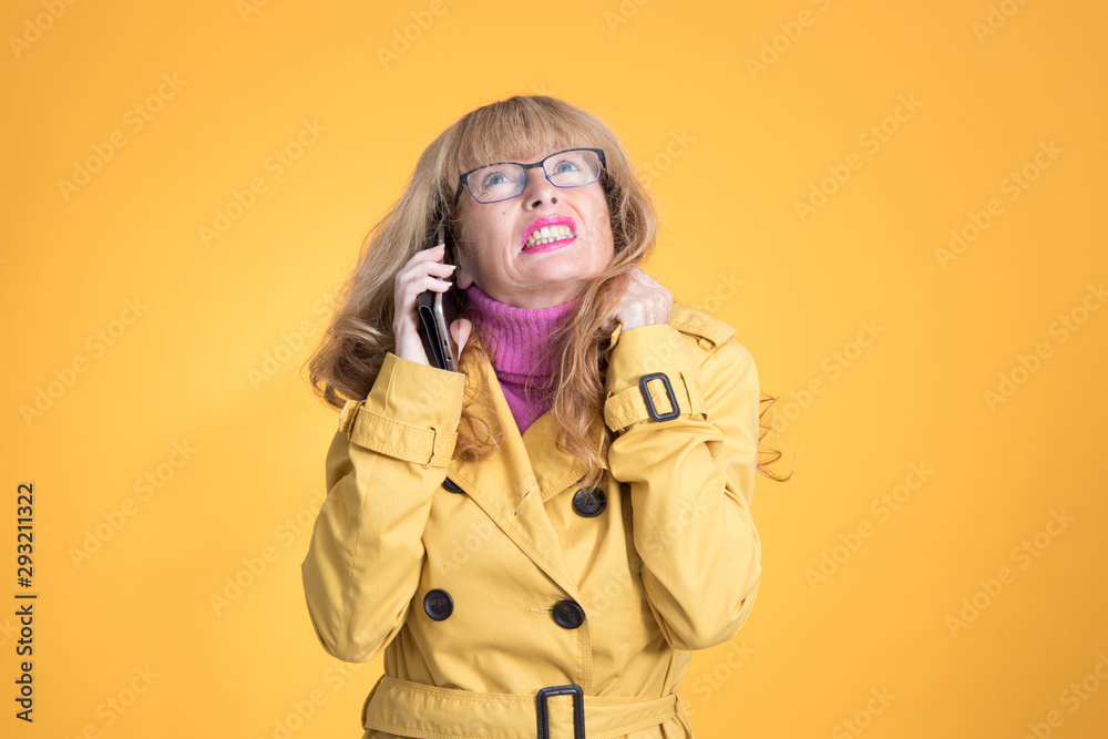 adult woman with mobile phone isolated on color background adult woman with mobile phone isolated on color background