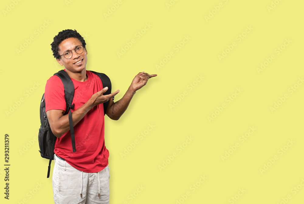 Amazed young man making a gesture of welcome Amazed young man making a gesture of welcome