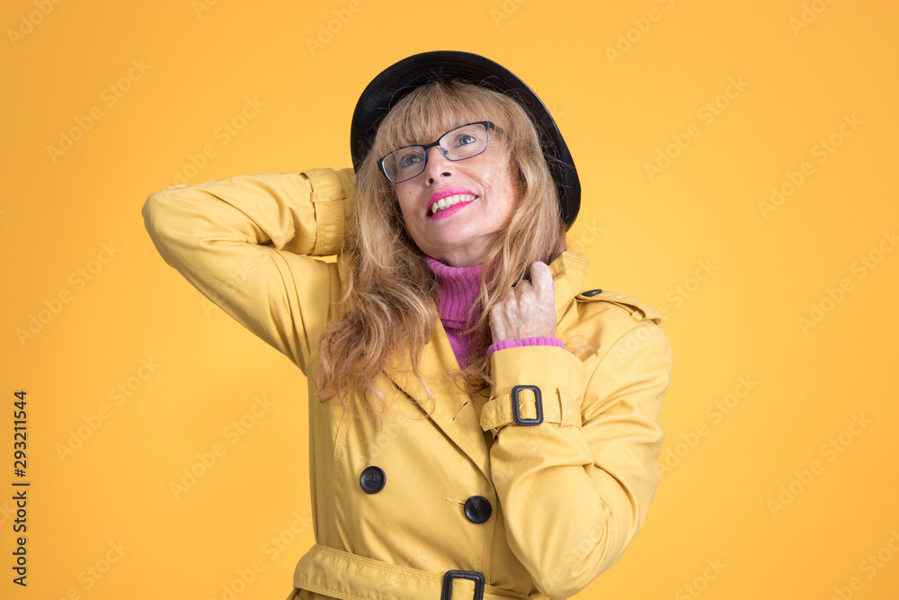 elegant adult woman with autumn style on color background elegant adult woman with autumn style on color background