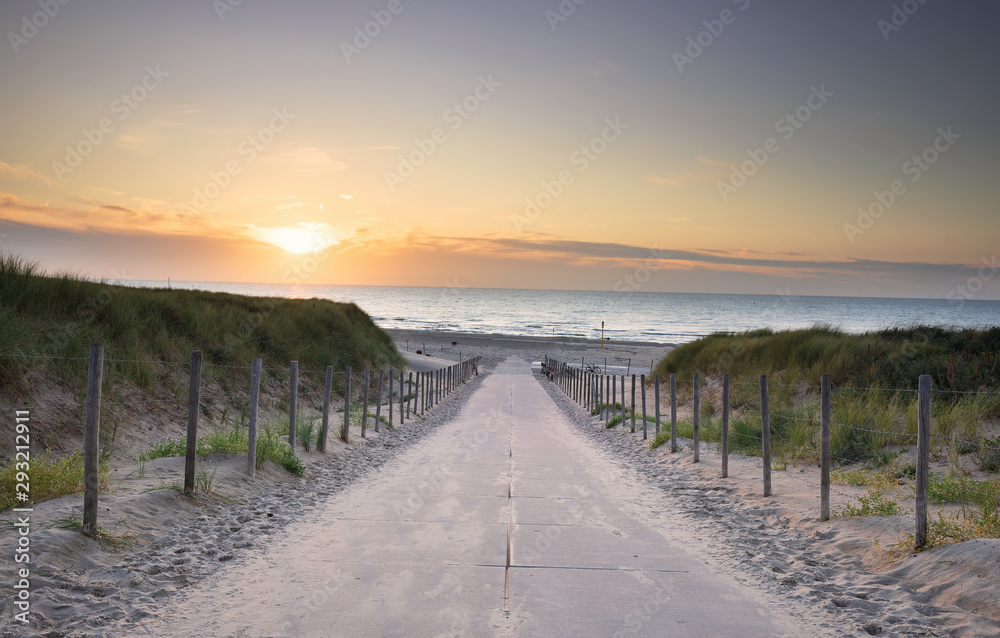 path to North sea beach at sunset