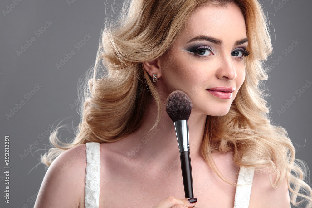 Beauty portrait of blonde beautiful woman with perfect makeup and hair style, isolated. Spa and hair, healthy skin Beauty portrait of blonde beautiful woman with perfect makeup and hair style, isolated. Spa and hair, healthy skin