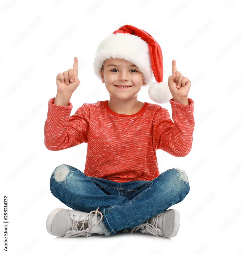 Cute little child wearing Santa hat on white background. Christmas holiday Cute little child wearing Santa hat on white background. Christmas holiday