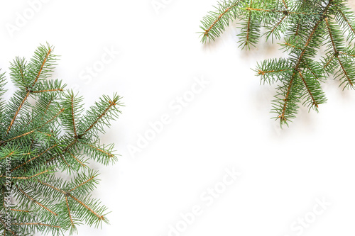 Christmas flat lay  Fir branches decorated with festive balls and Christmas decor on a white mocup background with copy space