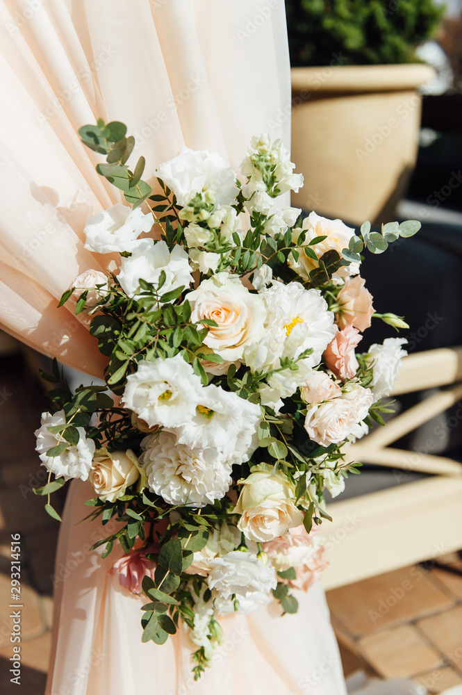 Arch for the wedding ceremony, decorated with cloth and flowers Arch for the wedding ceremony, decorated with cloth and flowers