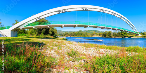 Fototapeta Naklejka Na Ścianę i Meble -  Suspension bridge for cyclists over Dunajec river near Nowy Sacz, Poland