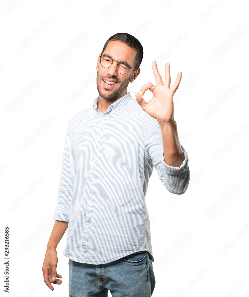 Surprised young man with a gesture of approval