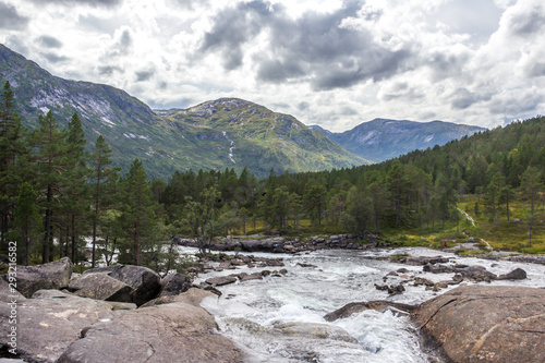 Likholefossen waterfall and mountain river in Norway