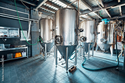 Fermentation mash vats or boiler tanks in a brewery factory photo