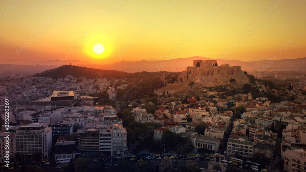 Aerial photo of iconic Masterpiece of Ancient world, Acropolis and the Parthenon at sunset with beautiful golden colours, Athens, Attica, Greece