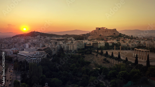 Aerial photo of iconic Masterpiece of Ancient world, Acropolis and the Parthenon at sunset with beautiful golden colours, Athens, Attica, Greece