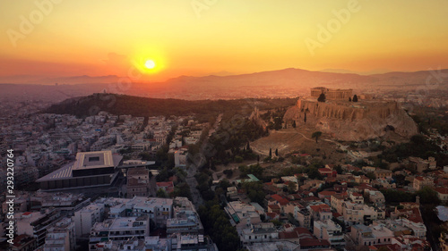 Aerial photo of iconic Masterpiece of Ancient world, Acropolis and the Parthenon at sunset with beautiful golden colours, Athens, Attica, Greece © aerial-drone