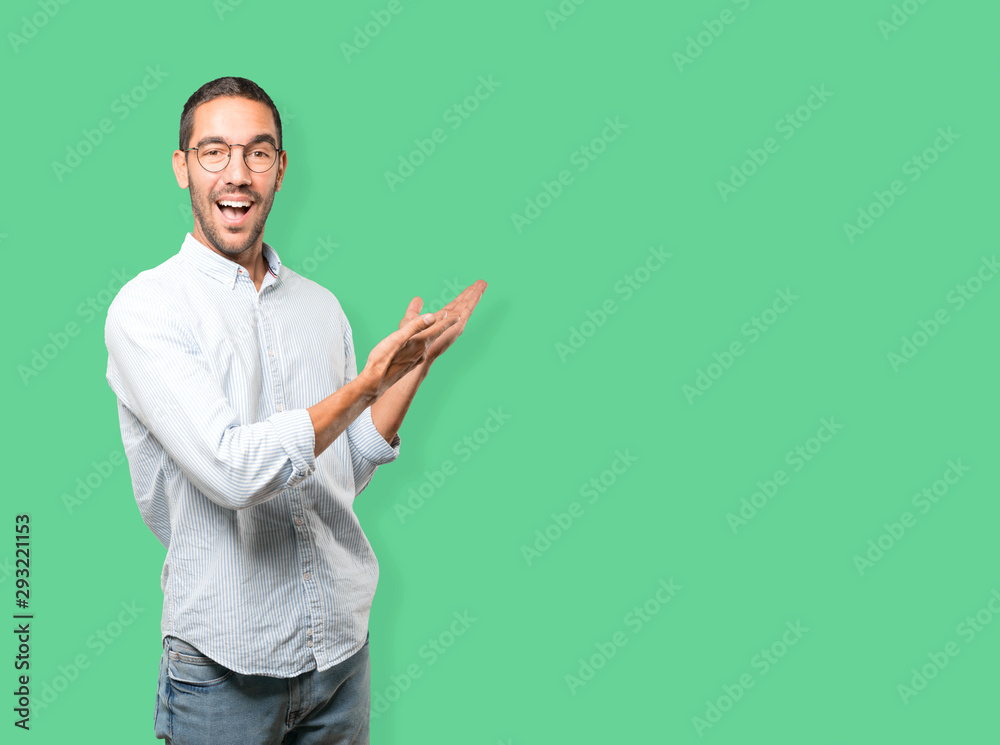 Amazed young man making a gesture of welcome Amazed young man making a gesture of welcome
