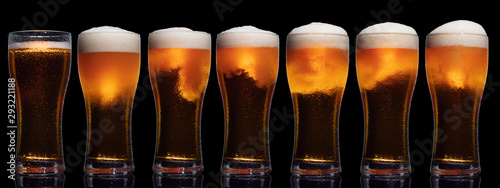 Set of Glasses of Beer Isolated on Black Background