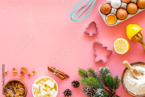 Kitchen frame. Dough ingredients and crockery on pink background top view space for text