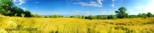 Beautiful panorama of Kaniv Reservoir shore, Ukraine, in sunny day with bright blue sky © tynza