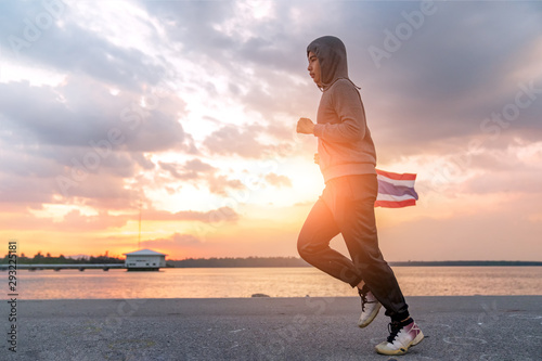 Fototapeta Naklejka Na Ścianę i Meble -  Asian men  jogging . Concept for relaxing .
