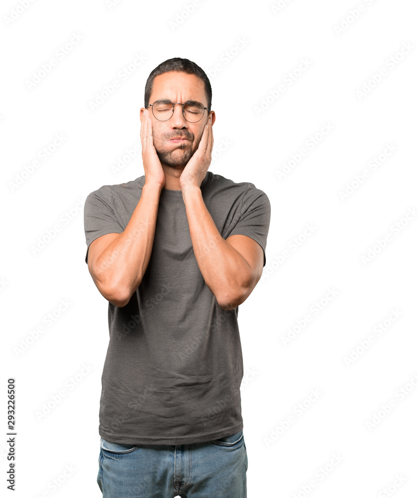 Concerned young man doing a gesture of relief