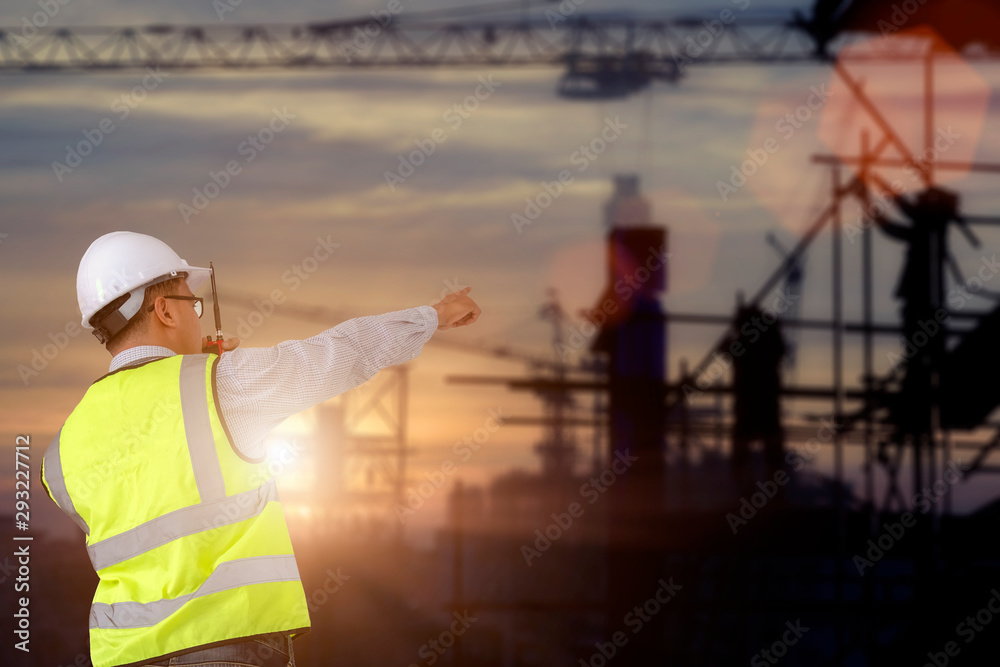 Double exposure of Engineer or Safety officer holding Walki talkie with oil refinery plant. Concept for construction and safety. Double exposure of Engineer or Safety officer holding Walki talkie with oil refinery plant. Concept for construction and safety.
