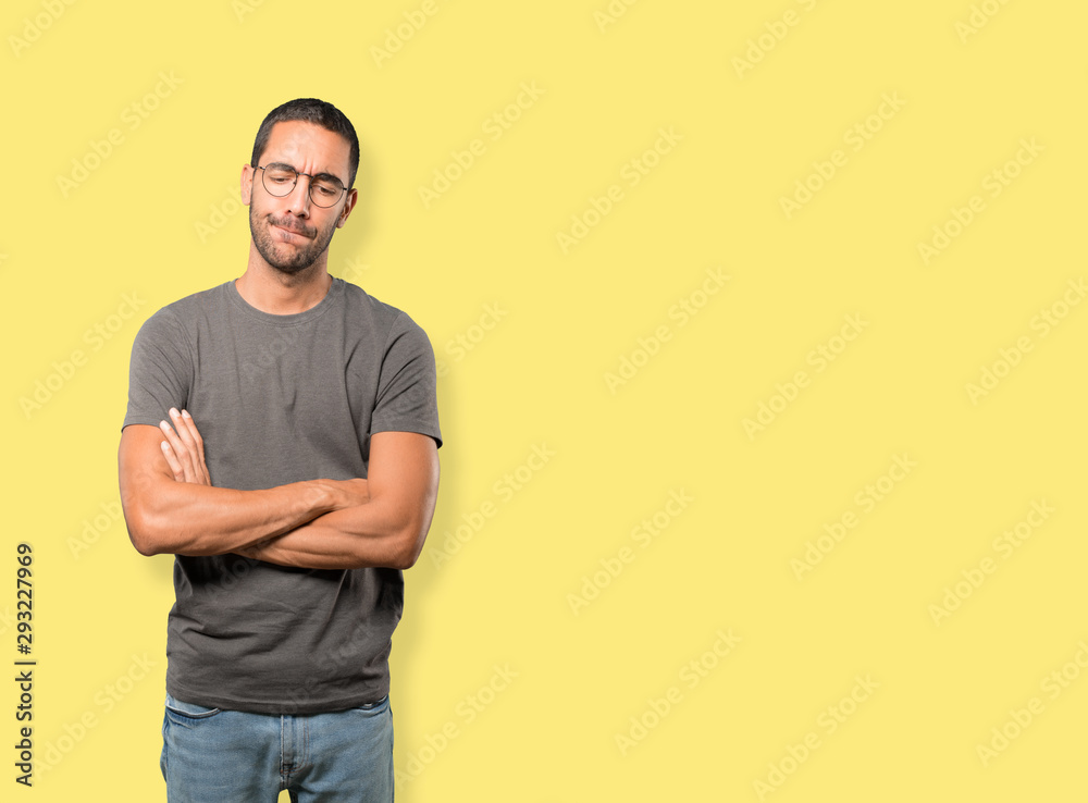 Serious young man with a gesture of disappointment Serious young man with a gesture of disappointment