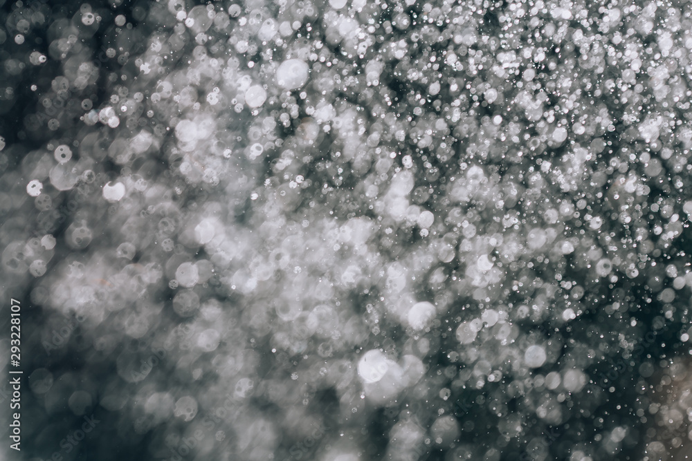 Obraz premium Rain. Beautiful rain background. Abstract rain texture closeup. Raindrops on a black background.