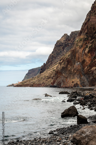 Pebble beach at the foot of a cliff - Madeira, Portugal