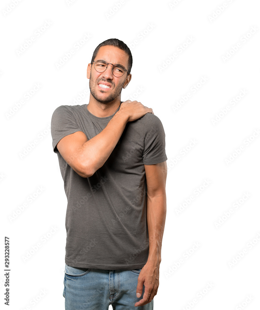 Concerned young man with a gesture of pain Concerned young man with a gesture of pain